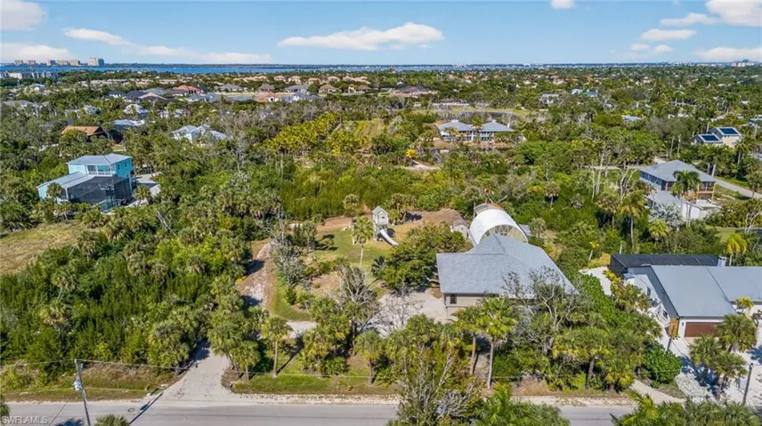 Aerial view of residential area with a tree filled landscape