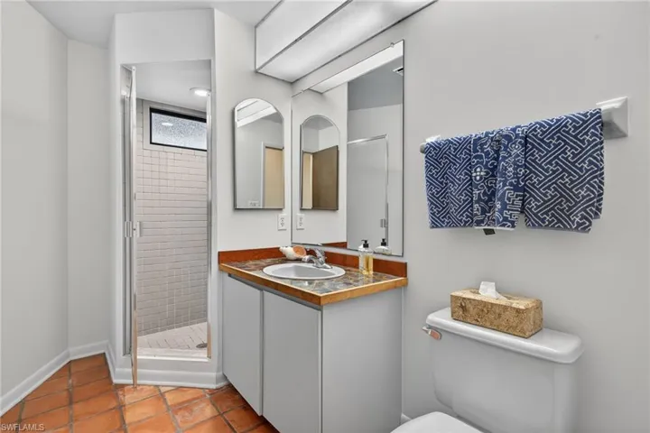 Full bathroom with a stall shower and vanity