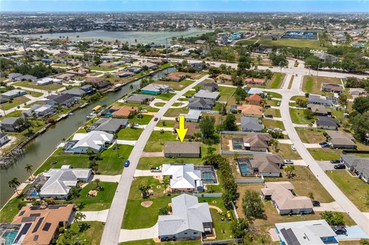 Drone / aerial view featuring a water view and a residential view