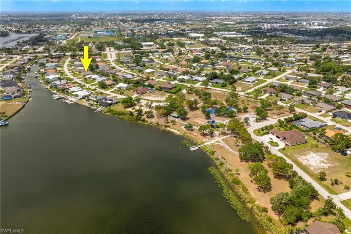 Drone / aerial view featuring a water view and a residential view