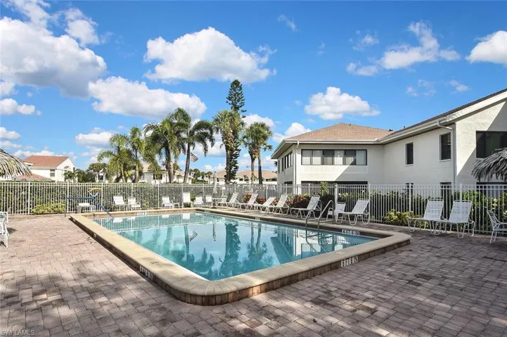 Community pool with a patio area