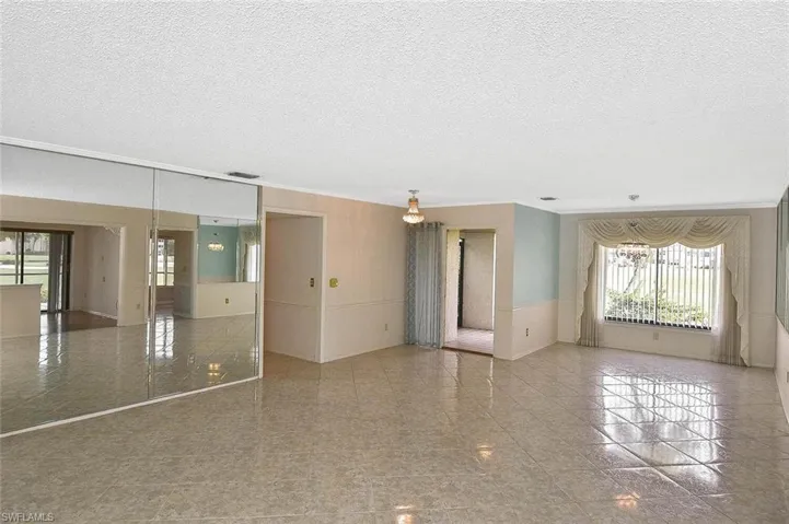Empty room with a textured ceiling