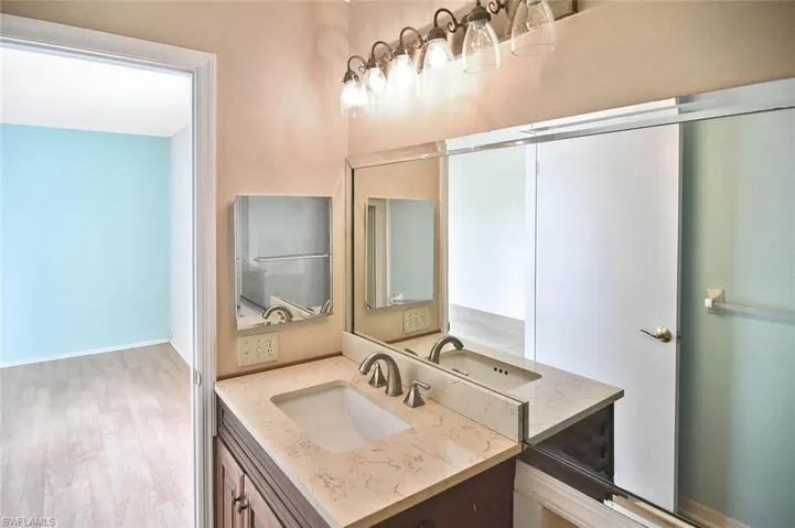 Bathroom with vanity and wood finished floors