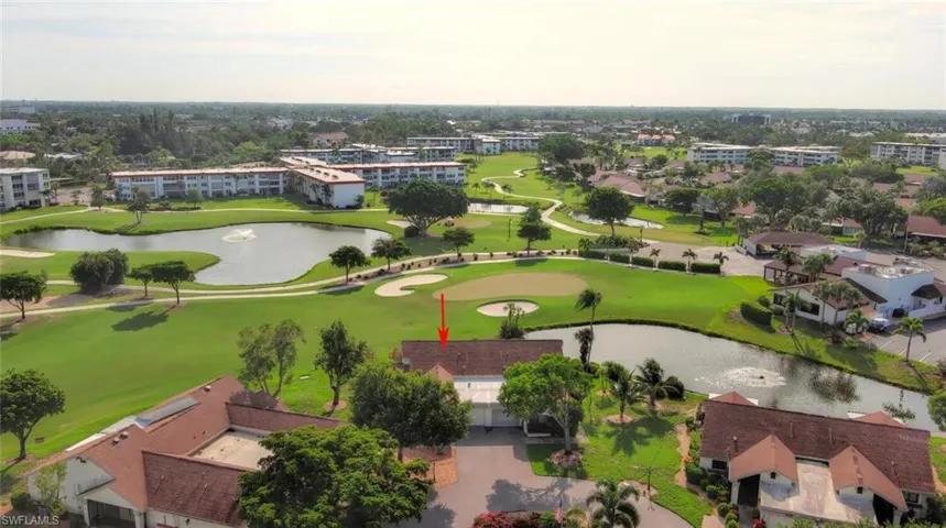 Aerial view of a local golf course and a large body of water