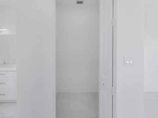 Bathroom with vanity and tile patterned flooring