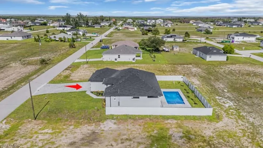 Aerial view of residential area with a pool