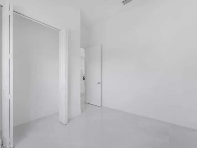 Unfurnished bedroom featuring a closet