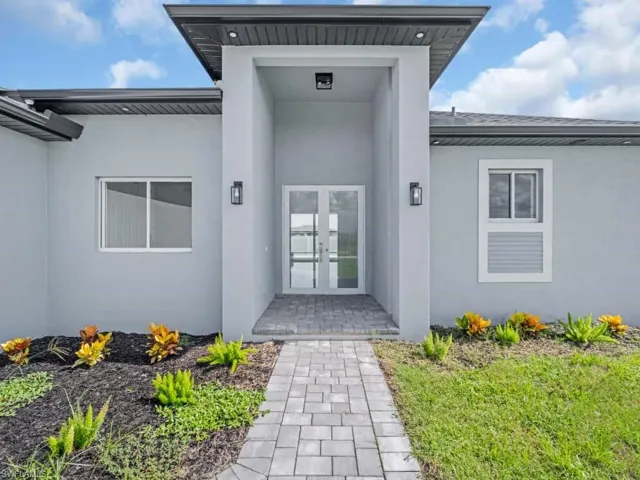 Entrance to property with french doors and stucco siding