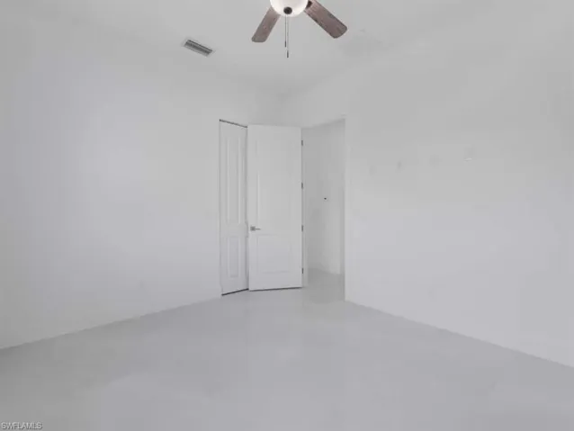 Unfurnished room featuring a ceiling fan
