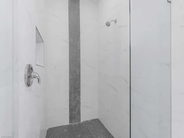 Bathroom with a tile shower
