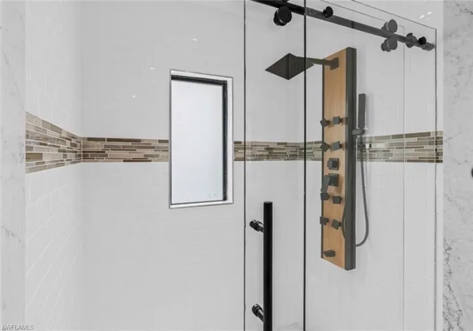 Full bath with a shower stall