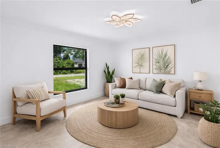 Living room featuring ornamental molding
