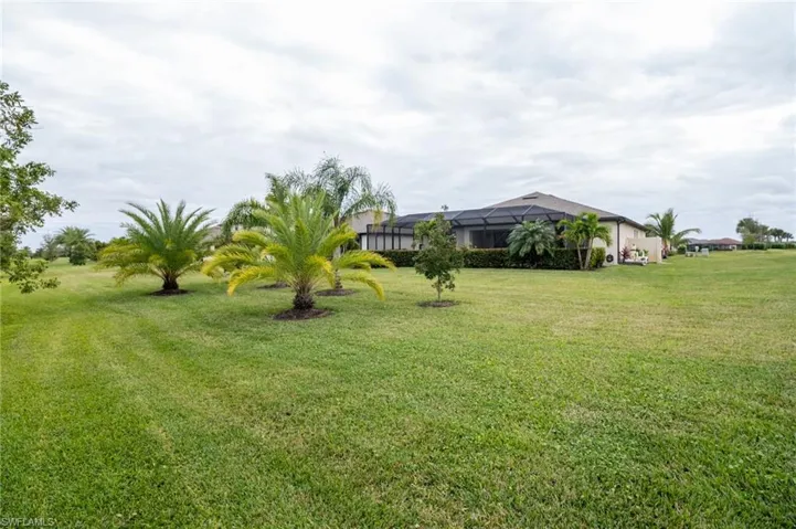 View of yard featuring beautiful landscaping