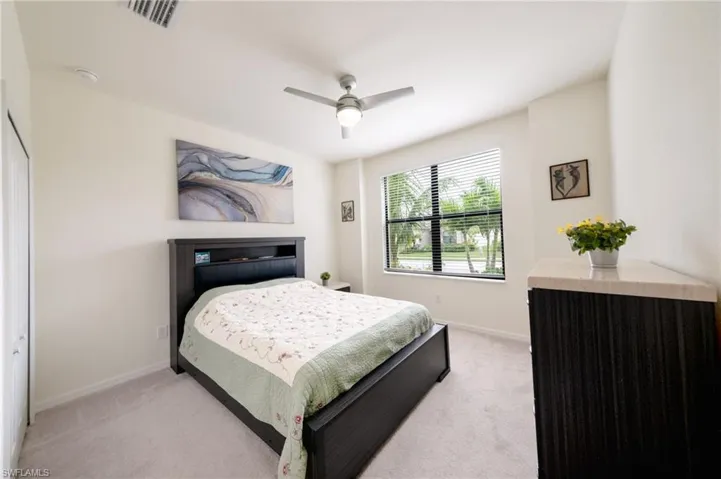 Guest Bedroom #3 featuring ceiling fan and a closet