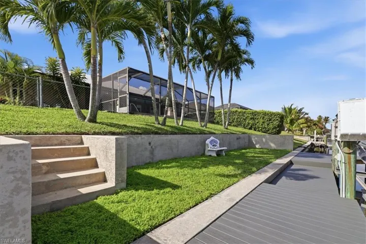 Dock area featuring a lanai and boat lift