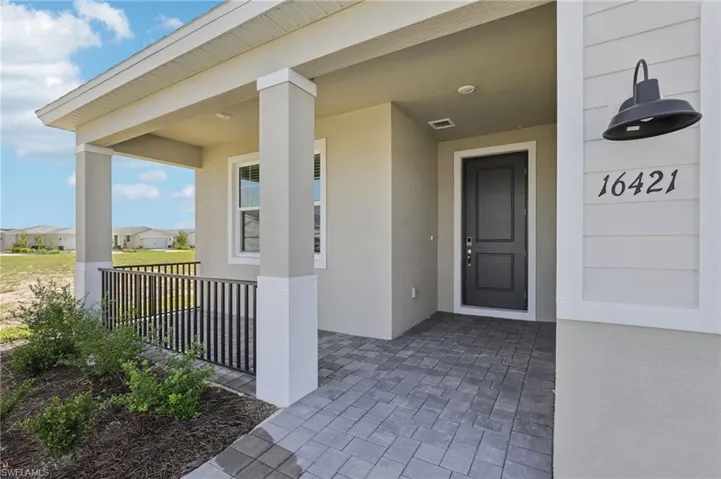 Doorway to property with stucco siding