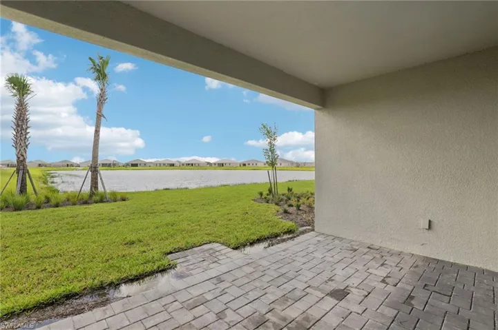 View of patio featuring a water view and a residential view