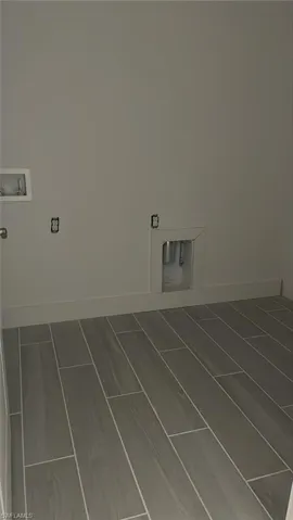 Laundry room with washer and gas dryer hookop