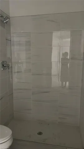 Guest bathroom with frameless walk-in shower