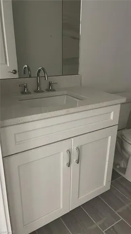 Guest bathroom with lovely quartz countertops and soft-close cabinets