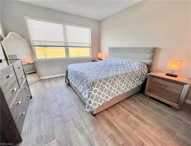 Bedroom featuring wood-type flooring
