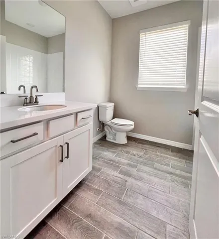 Bathroom with vanity and toilet