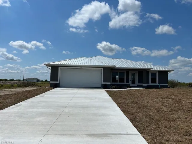View of front of house with a garage