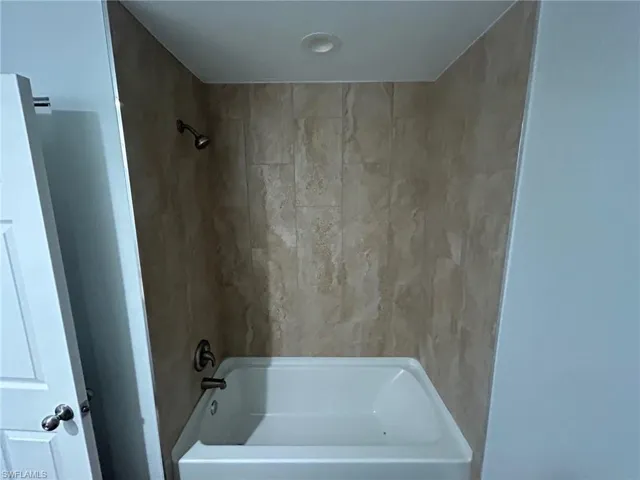Bathroom with shower / bath combination