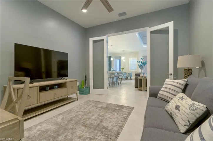 Flex space with French doors and tile floor