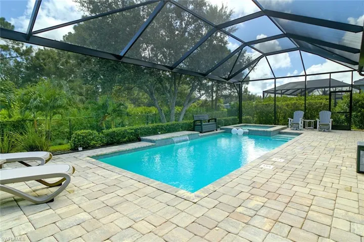 Paver lanai with outdoor living area and built in kitchen area and ceiling fan