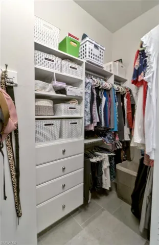 Primary bathroom with two vanities and a large walk-in shower