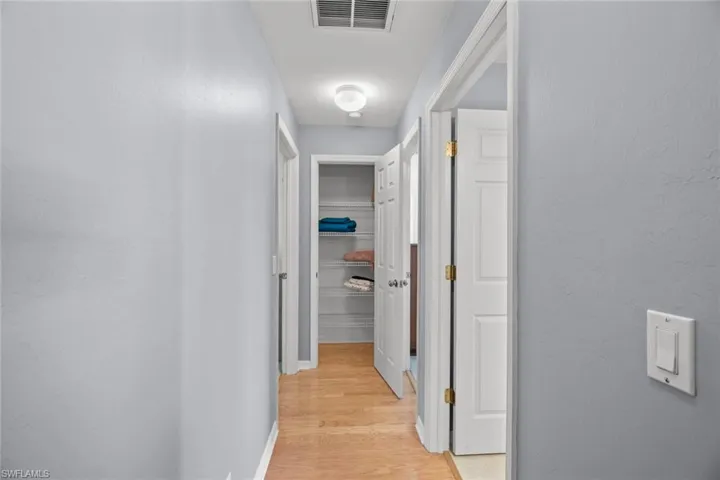 Hallway to 2 Separate Bedrooms & Full Pool Bath, 1 of 2 Linen Closets in halls to bedrooms