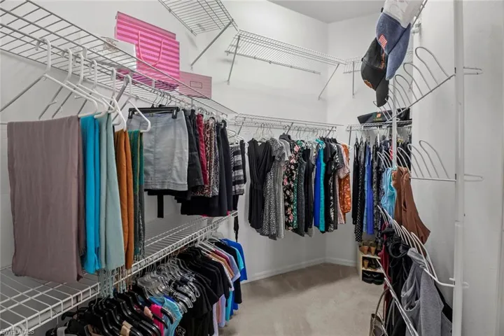 Huge Walk-in Closet with additional space in back right. High Ceiling