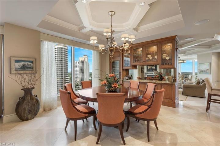 A custom bar is perfectly located between the dining are and family room.