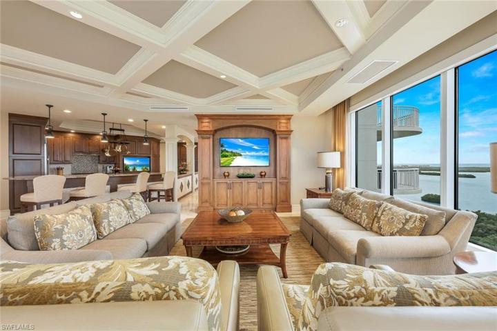 All main living spaces are open to one another - family room, kitchen, dining and enclosed lanai.