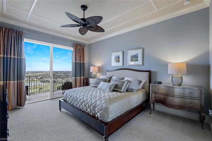 Guest bedroom with sliding doors leading to open air balcony.