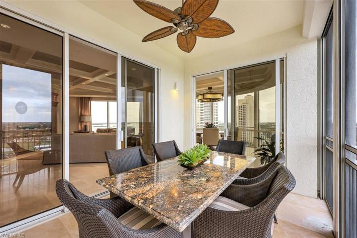 Screened lanai located next to kitchen.