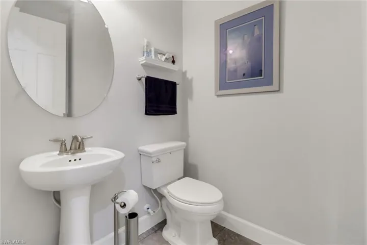 Bathroom featuring tile patterned floors and toilet