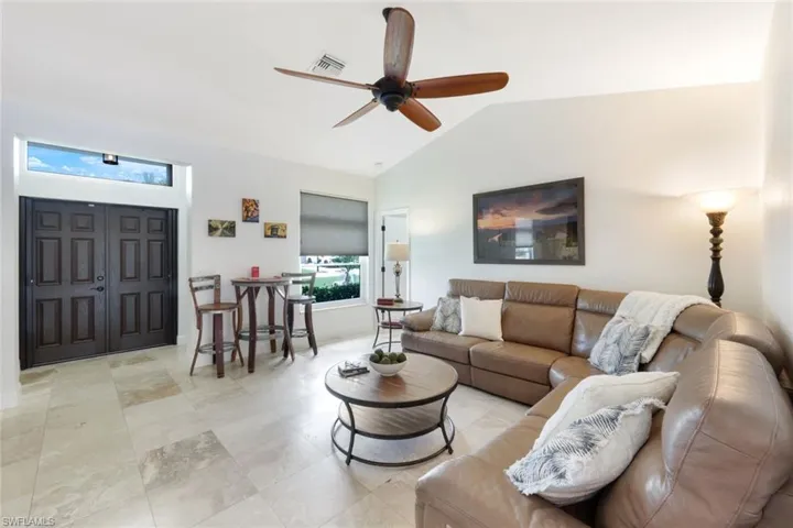 Double door front entry and spacious living room.
