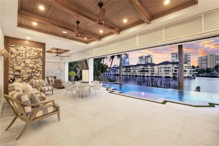 Outdoor fireplace overlooking pool area