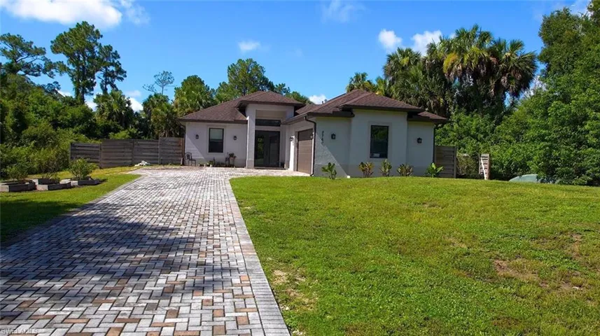 Mediterranean / spanish-style home featuring a front lawn