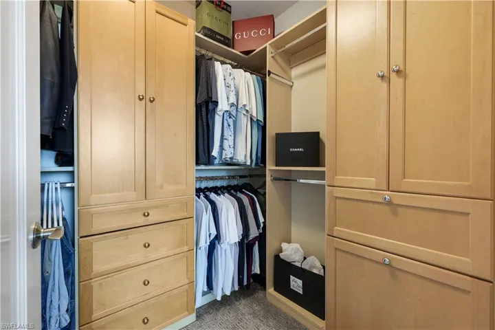 Walk in closet with built-in cabnites