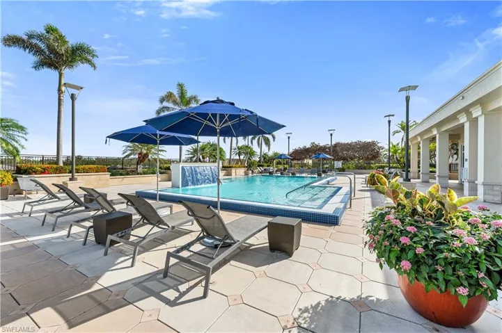 Community pool featuring a patio