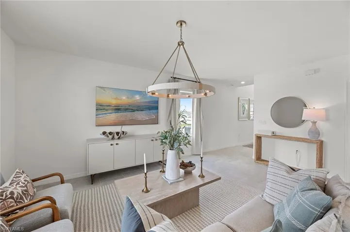 Living room with baseboards and light tile patterned floors