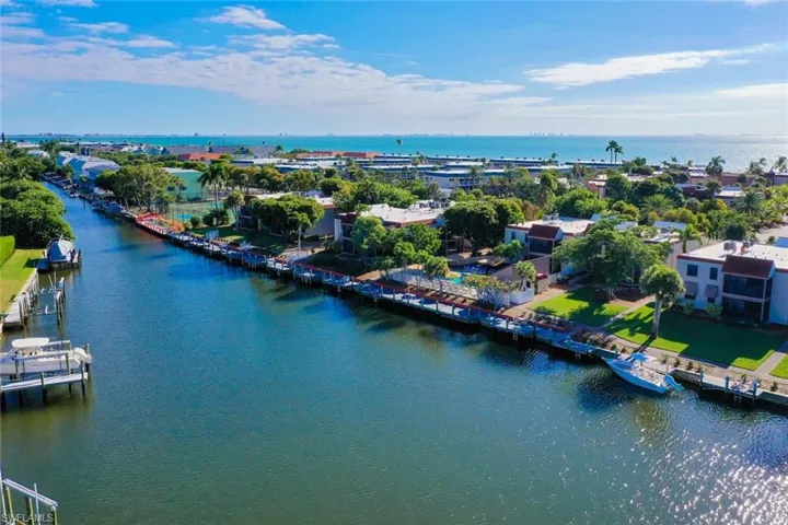 Canal-front property featuring extensive waterfront, private boat docks, and direct water access