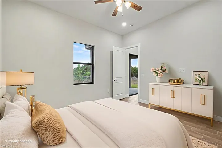 Bedroom with wood finish floors and a ceiling fan