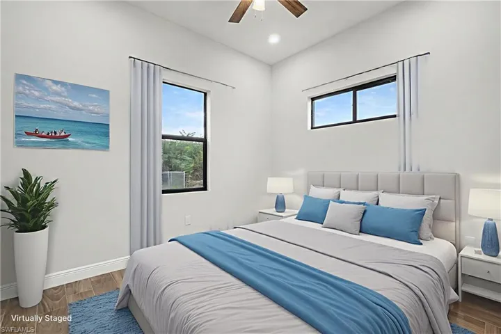 Bedroom featuring wood finished floors, ceiling fan, and recessed lighting
