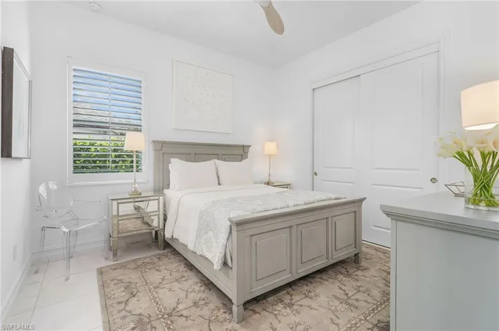 Bedroom with a closet and a ceiling fan
