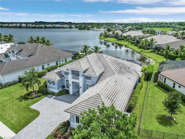 Aerial view of residential area featuring a large body of water