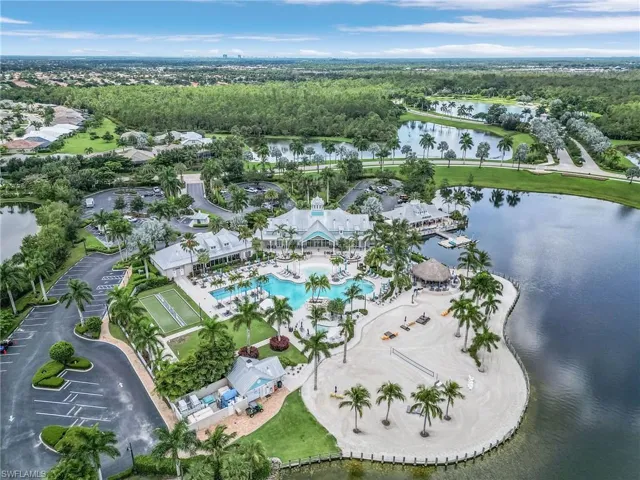 View of property location with a nearby body of water and a pool